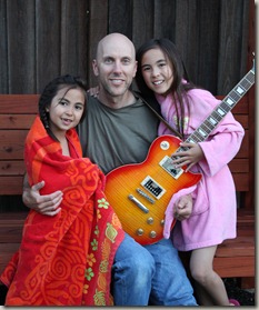 Emily, Sophie and Daddy with the birthday present