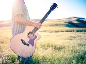 Guitar Sunset Over Shoulder